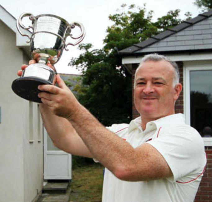 Whitland skipper Wayne Jones raises the Alec Colley Cup